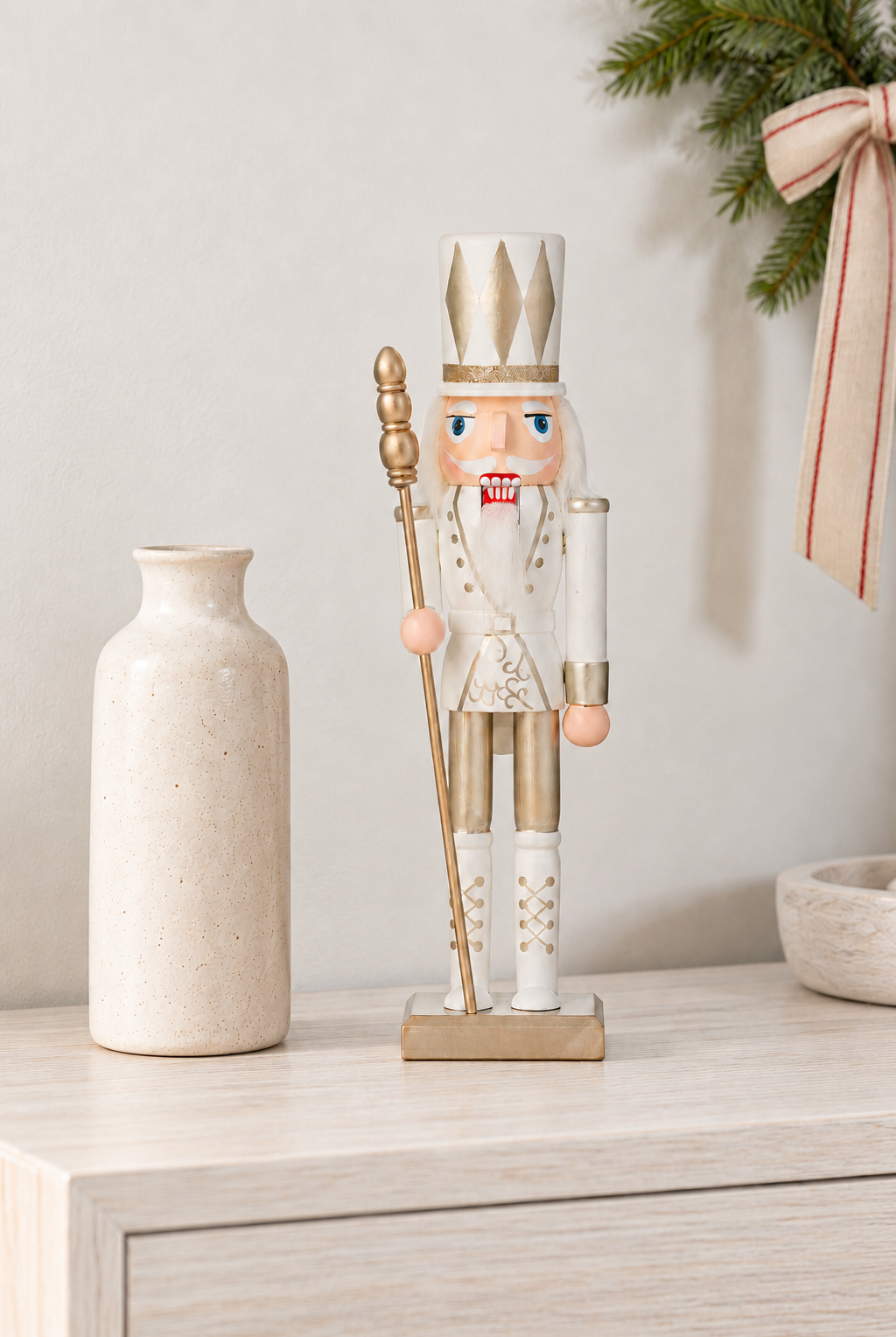 Nutcracker with Baton - Gold & Pink, 30cm styled indoors with pale whitewashed furniture and summer light; Coast to Coast XM0131
