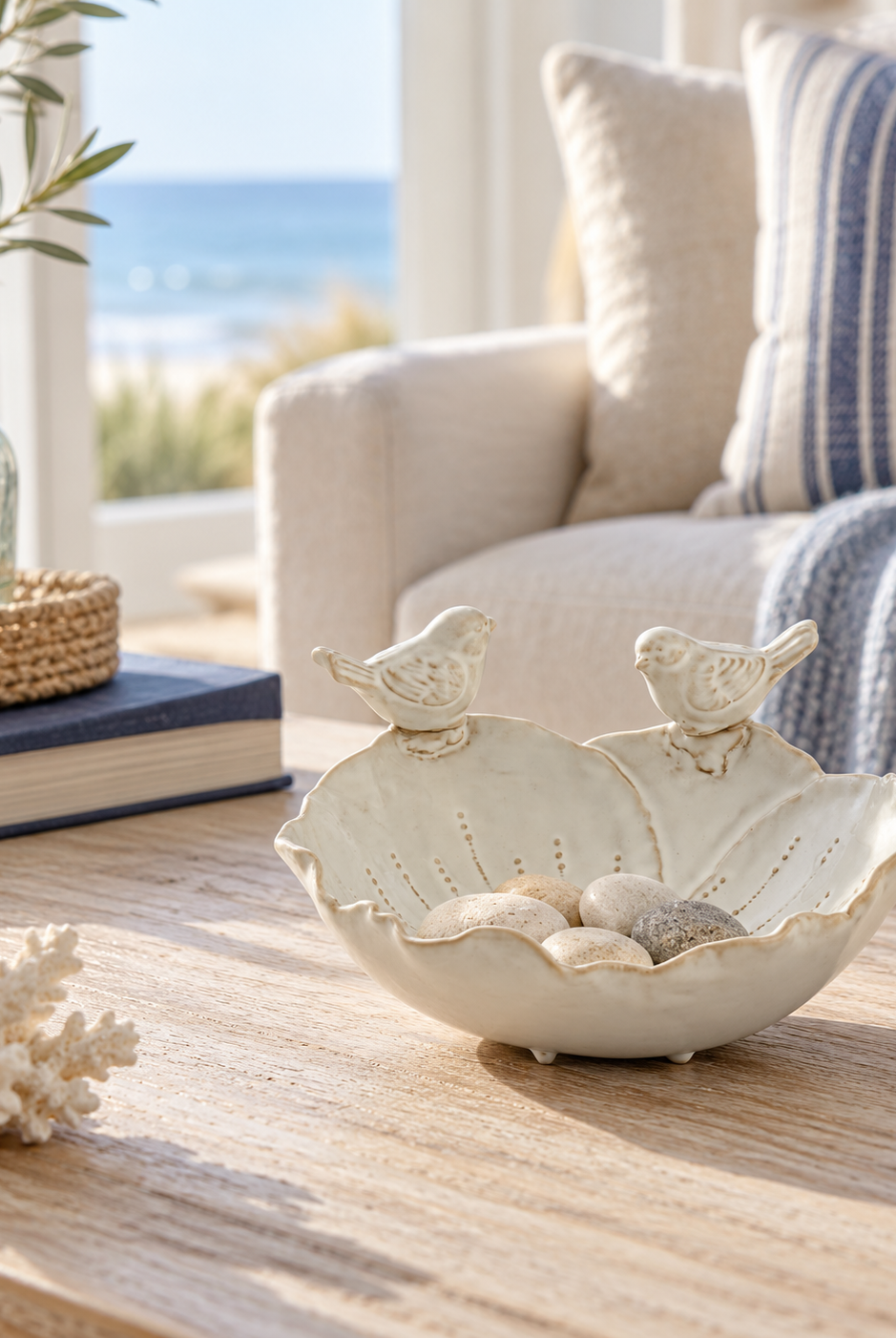 Cream bird decorative bowl styled in a light coastal sitting room