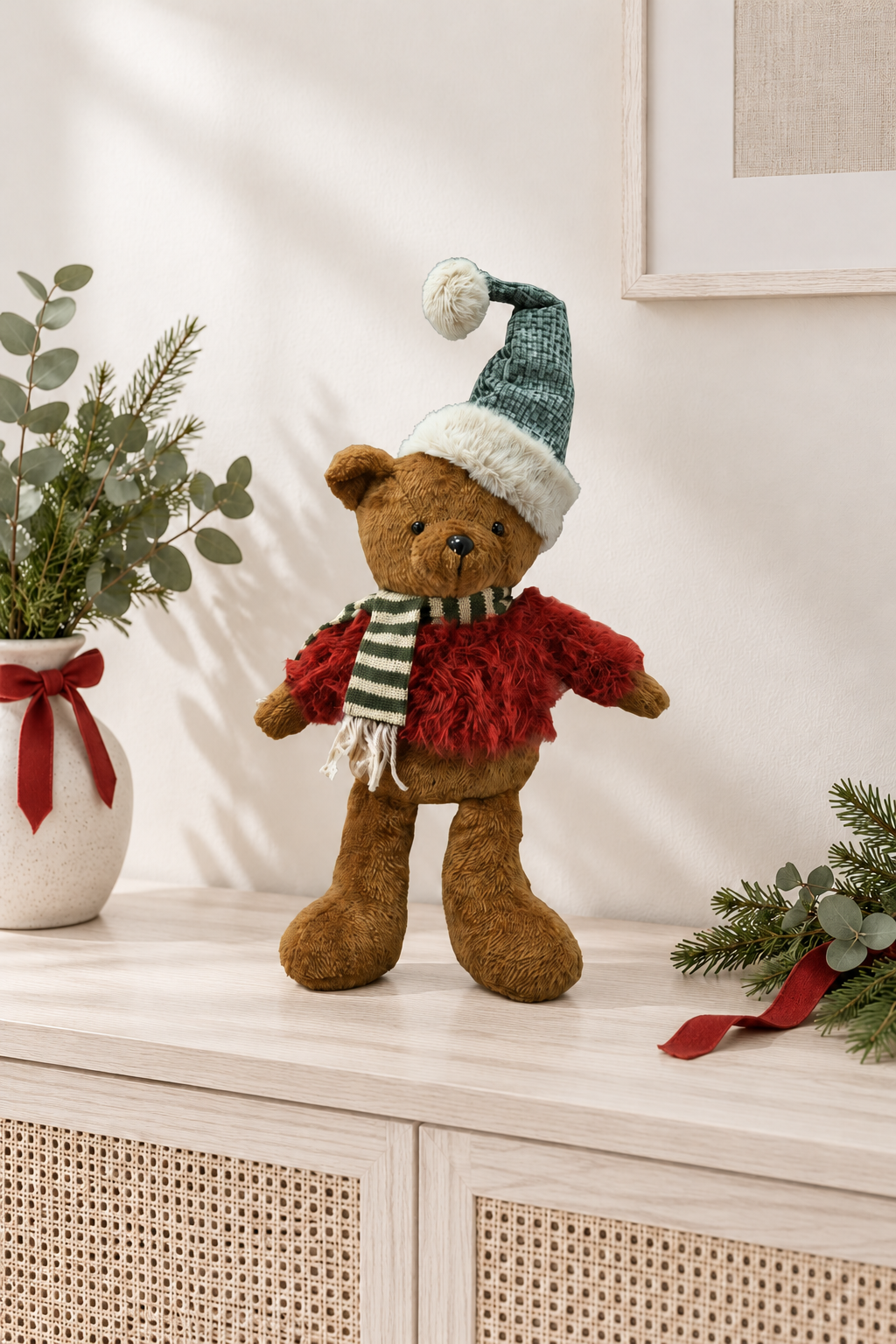 Christmas Bear in Sweater styled indoors with pale whitewashed furniture and summer light; Coast to Coast XM0191
