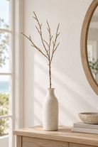 Natural bud branch styled in a coastal home