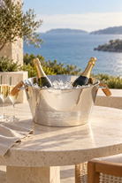 Monaco Soirée champagne bucket styled with champagne and ice on a coastal terrace