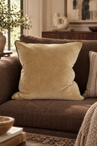 Clyde Gold Velvet Cushion styled in salon