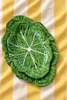 Green Large Oval Platter – Cabbage Melamine on yellow and white striped tablecloth