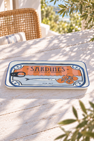 Sardines rectangular serving plate 38.5 by 25 centimetres on a sunlit coastal table